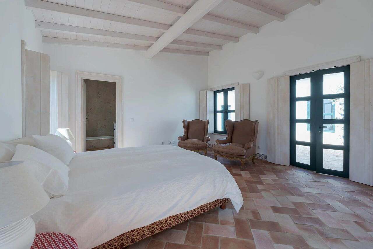 A double bedroom, doors to the garden