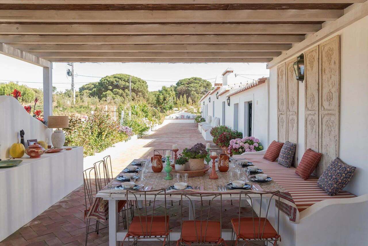 The covered dining terrace, laid for lunch