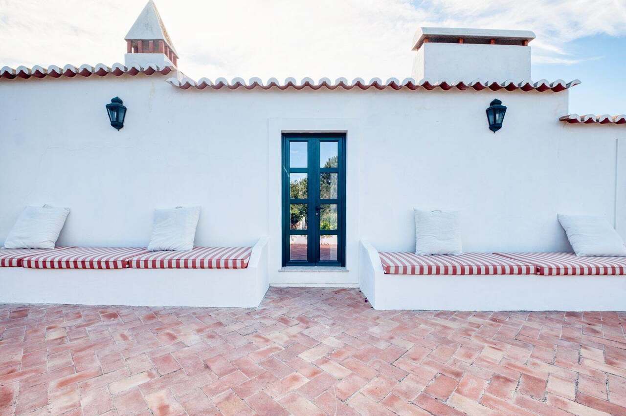 The whitewashed farmhouse facade