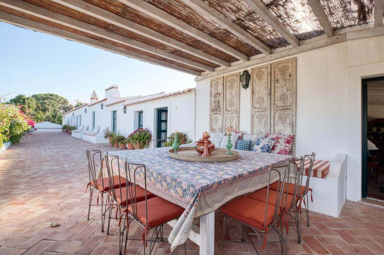 The long table under the cane roof
