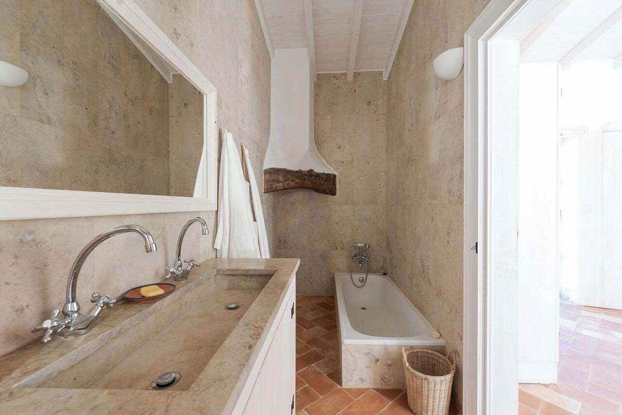 The stone bathroom with its deep tub