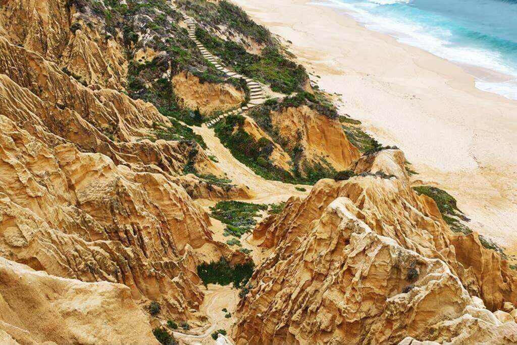 Sandstone cliffs and steps above the beach