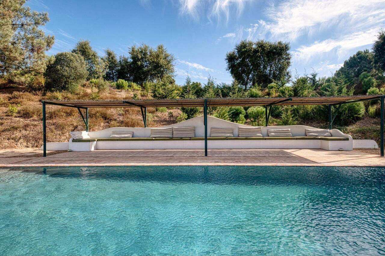 The pool pergola, shaded seating